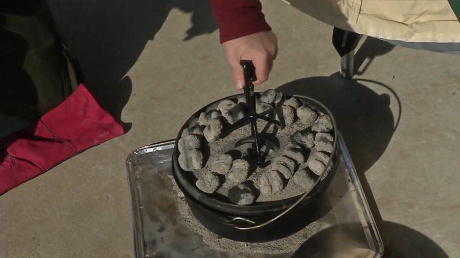 removing the oven from the charcoal