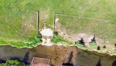 Aerial view of a newly installed gate system in a stream bank fencing project on the North Raven river